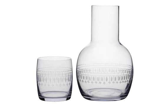 A Crystal Carafe Set with Ovals Design