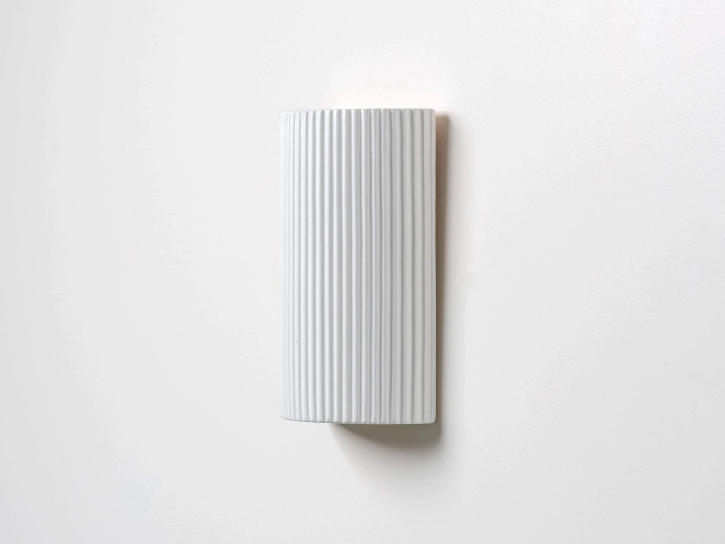 White ribbed ceramic pillar wall light