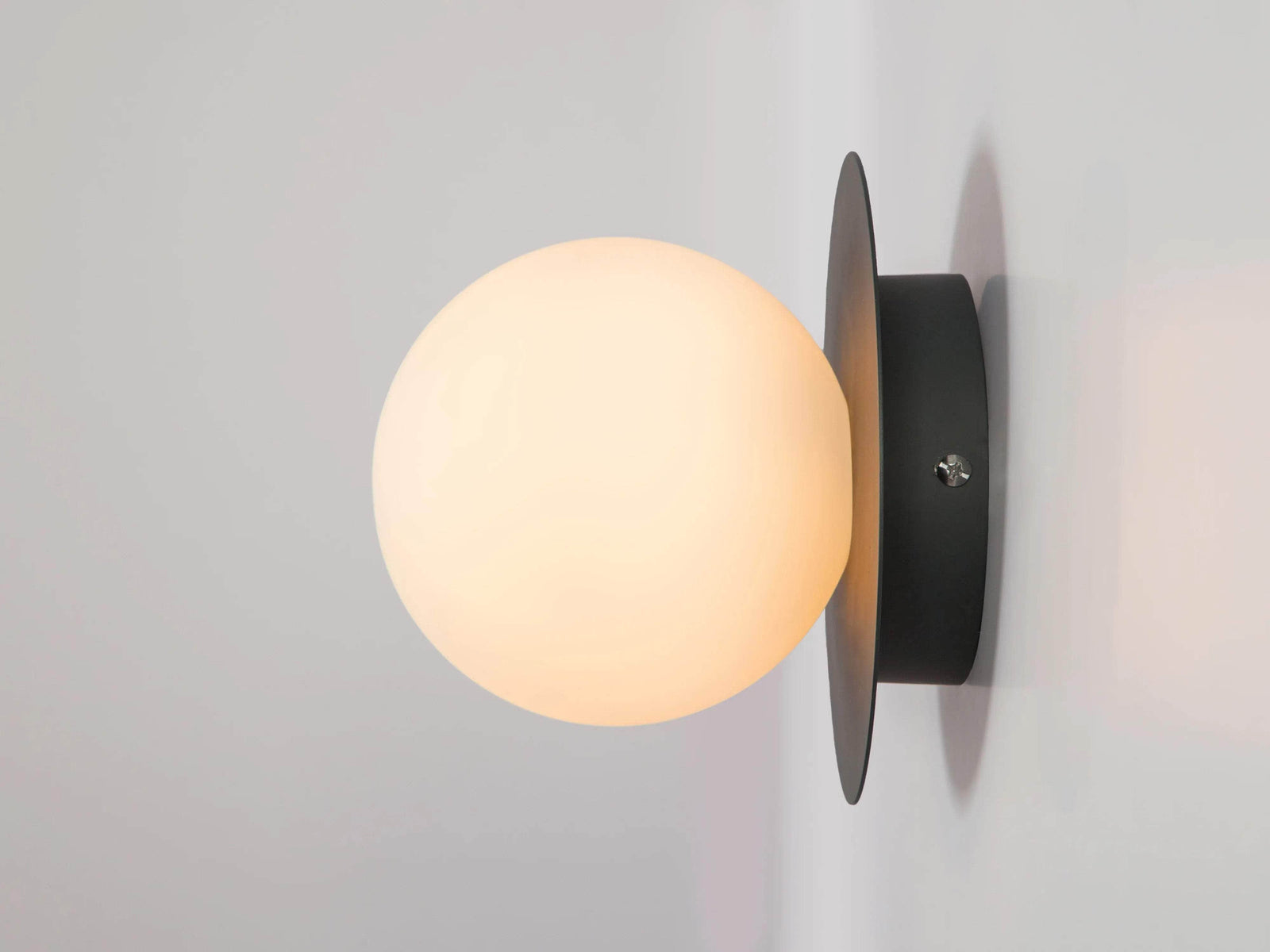 Charcoal grey opal disk wall light