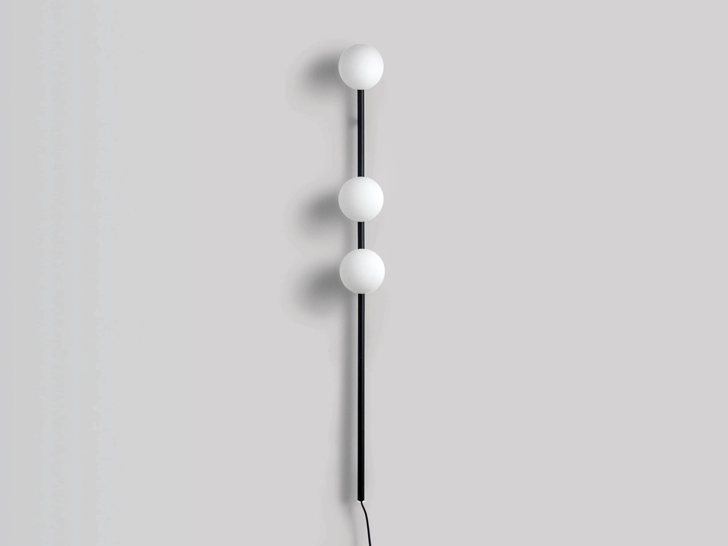 Charcoal grey bar opal ball wall light