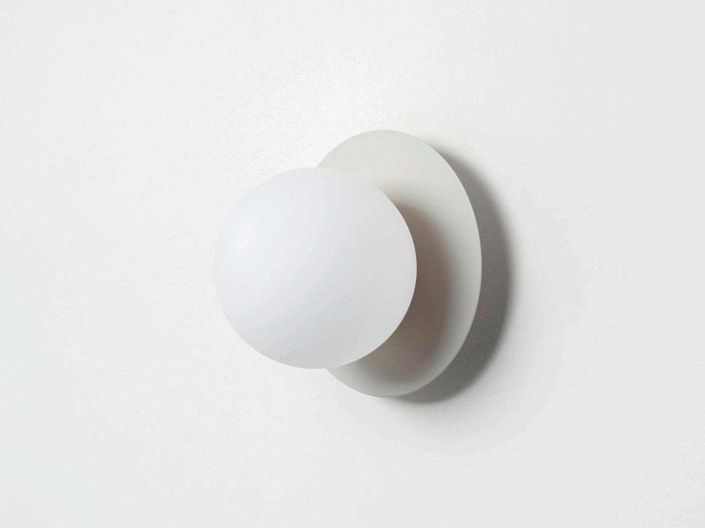 Sand opal disk wall light