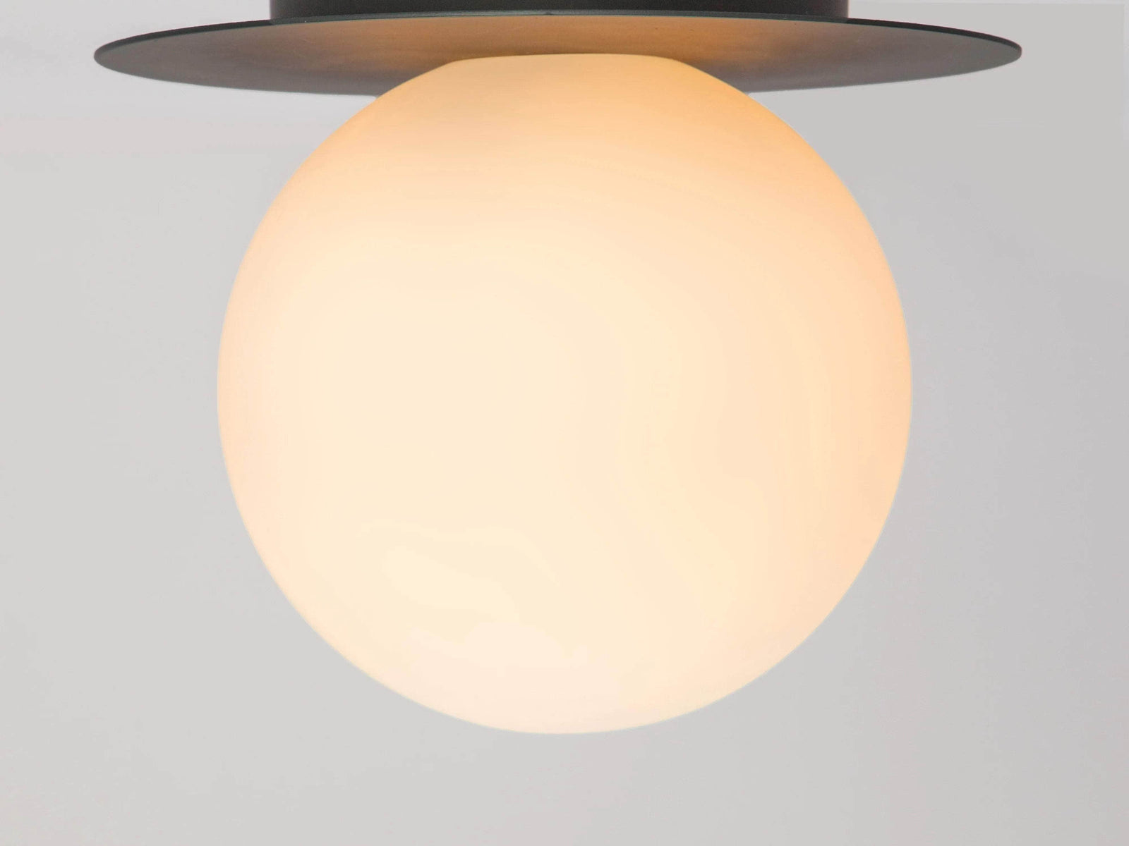 Charcoal grey opal disk wall light