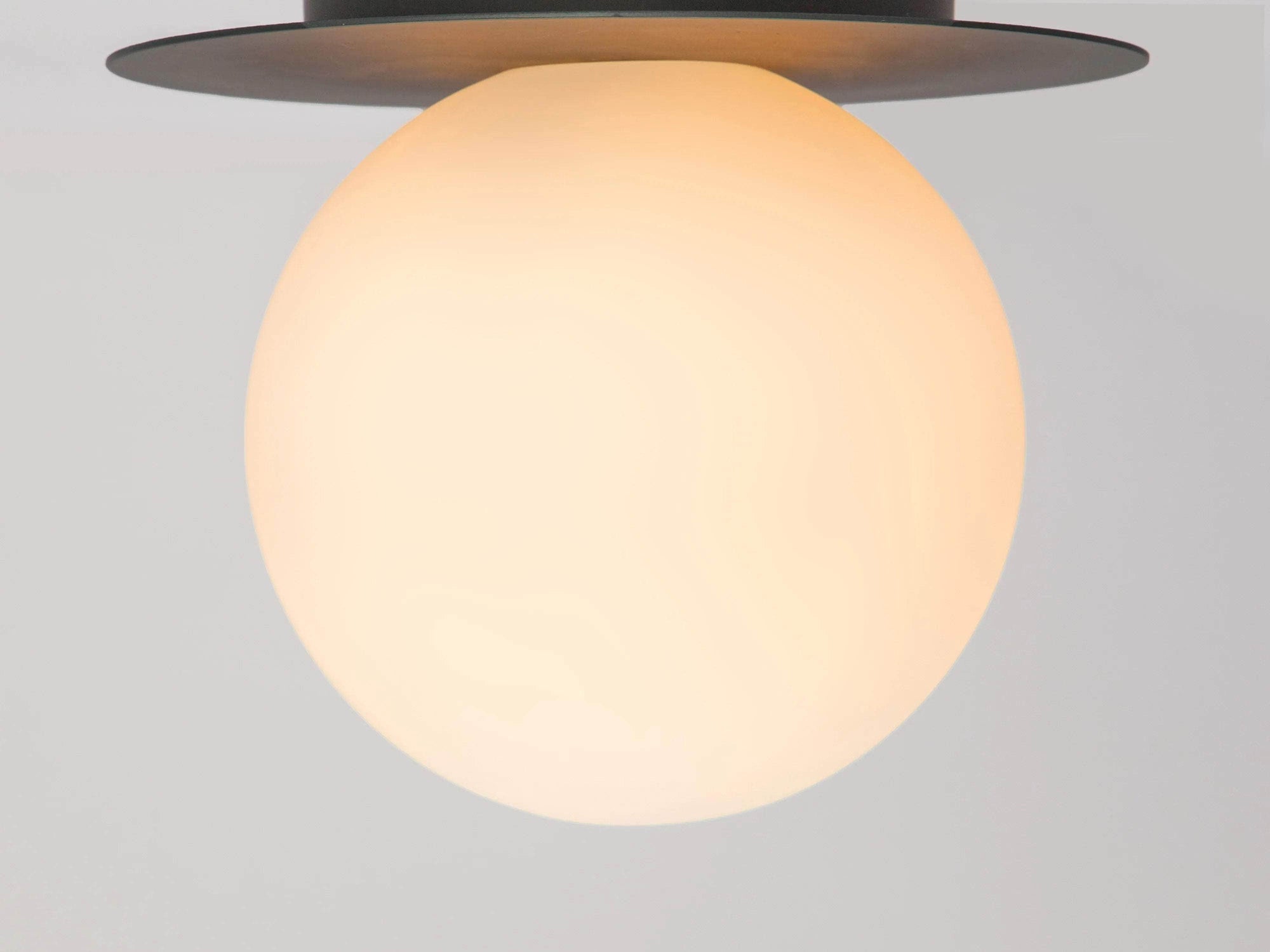 Charcoal grey opal disk wall light