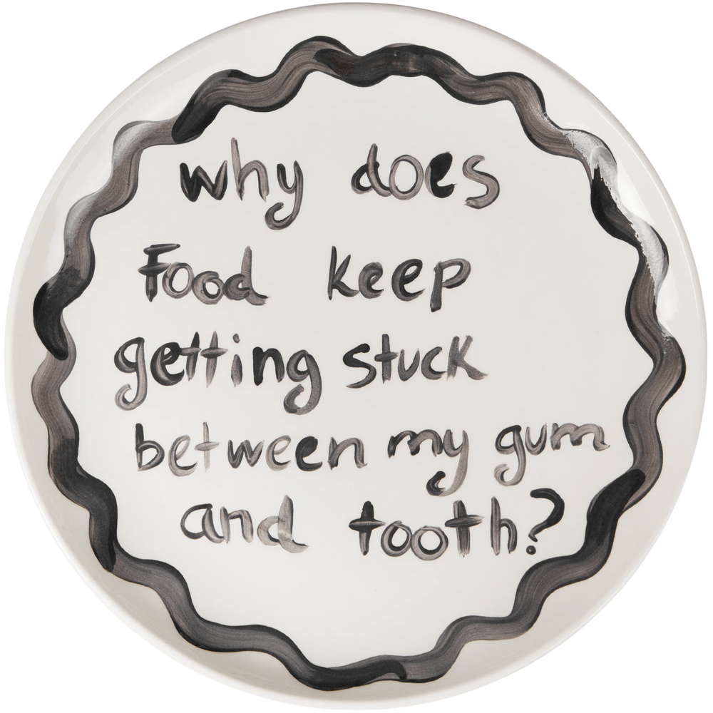 "Why Does Food Keep Getting Stuck Between My Gum and tooth" Plate