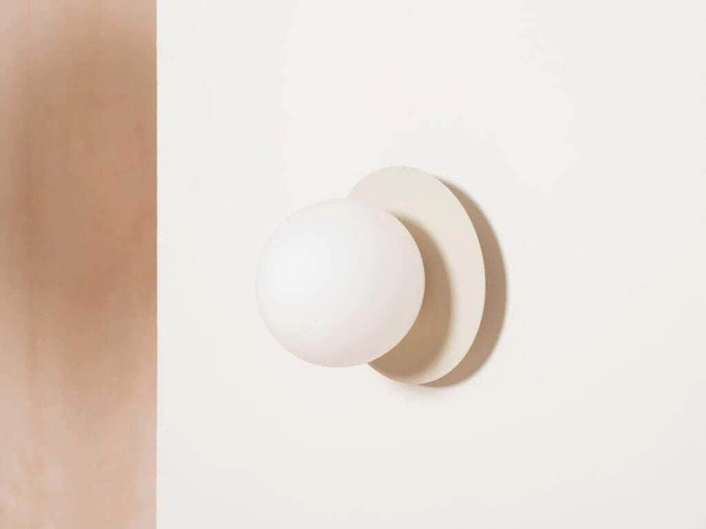 Sand opal disk wall light